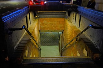 Illuminated Subway Entrance at Night