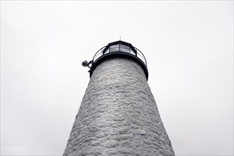Low Angle View of Lighthouse against Foggy Sky
