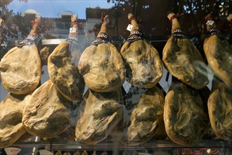 Cured Ham hanging in Store Window