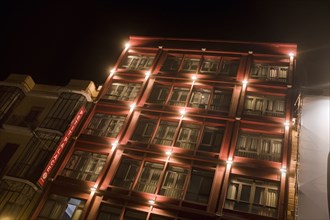 Illuminated Apartment Building at Night