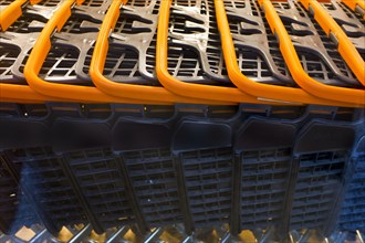Detail of Row of Shopping Carts with Orange Handles