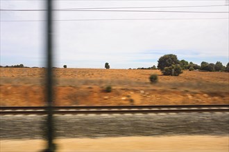 Arid Landscape View through Train Window