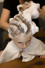 Young Boy having his Hair Washed