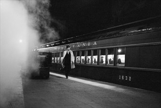 Man walking on platform next to train