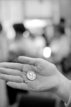 Hand holding Susan B. Anthony Dollar Coin