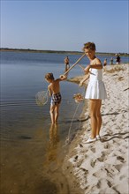 Family crabbing at Beach