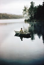 Man Trout Fishing from Row Boat