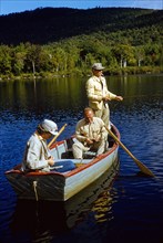 Two Men and Woman Trout Fishing from Row Boat