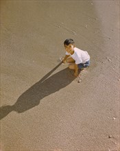 High Angle View of Young Japanese Boy on Beach