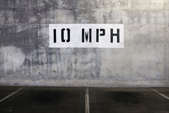 10 mph Speed Limit Sign painted on Wall of Parking Garage