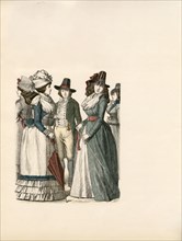 Fashionable man and small group of women