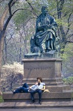 Couple relaxing at base of Statue