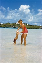 Woman playing with young Boy at Beach