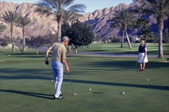 Man and Women on Putting Green