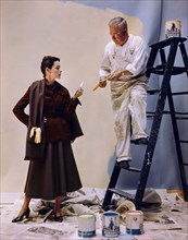 Woman discussing Color Samples with Painter