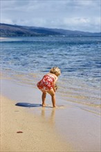 Rear View of Young Girl at Beach