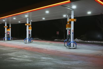 Gas Station Pumps at Night