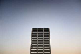 Modern Office Building Exterior against Sky at Dusk