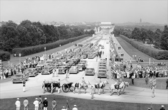 Funeral Procession and Flag-draped casket of U.S. Secretary of State John Foster Dulles on horse-drawn caisson at entrance to Arlington National Cemetery