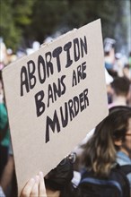 Abortion Bans are Murder Sign at Abortion Rights Rally