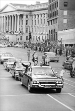 Astronaut Gordon Cooper in a car with U.S. Vice President Lyndon Baines Johnson during parade