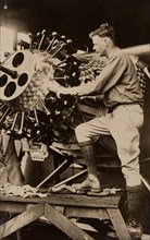 Charles Lindbergh working on engine of his airplane Spirit of St. Louis