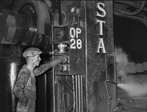 Steel worker loading sheet metal