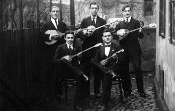 Group of Men playing Mandolins