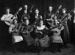 Portrait of a Group of Young Musicians with Acoustic Guitars