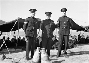 Three British constables as guests at tribal lunch at cavalry post 20 miles North of Beersheba