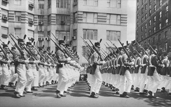 Soldiers in uniform marching in parade