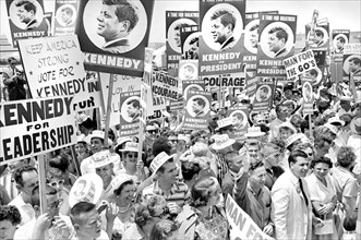 Supporters of U.S. Senator John F. Kennedy with placards at airport during 1960 Democratic Convention