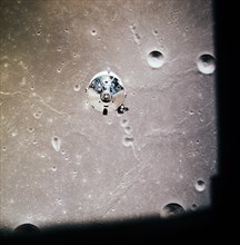 The Apollo 11 Command and Service Modules photographed from Lunar Module in lunar orbit during Apollo 11 lunar landing mission