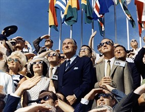 U.S. Vice President Spiro Agnew [right center] and Former U.S. President Lyndon Johnson (left center] amongst crowd viewing lift-off of Apollo 11