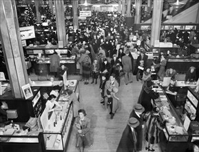 High angle view of customers in R.H. Macy department store week before Christmas, New York City,