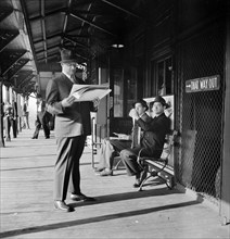 Morning commuters waiting for the Third Avenue elevated train, New York City, New York, USA,