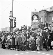 Crowd on street corner watching Armistice Day parade, Lancaster, Pennsylvania, USA, Marjory