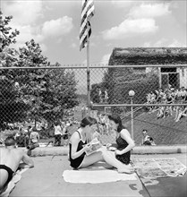 Two young women relaxing by community pool, Washington, D.C., USA, Marjory Collins, U.S. Office of