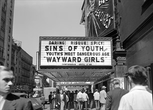 Street scene and risque movie marquee, 42nd Street, New York City, New York, USA, Marjory Collins,