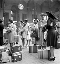 Group of women and children waiting for train, Pennsylvania Station, New York City, New York, USA,