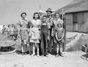Wilfred Tow, FSA (Farm Security Administration) rural borrower, with his family, Laredo, Montana,