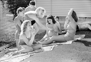 Group of young sun bathers at park swimming pool, Caldwell, Idaho, USA, Russell Lee, U.S. Farm