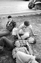 Group of young men relaxing on lawn, Imperial County Fair, El Centro, California, USA, Russell Lee,