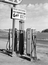 Gas station pump with sign that reads "War Defense For Farmers Only Gas 17 1/2 ¢", Twin Falls