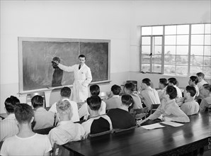 Instructor and students in class at vocational school for aircraft construction workers, San Diego,