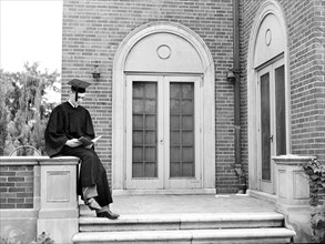 John Cockle in cap and gown on graduation day, University of Nebraska, Lincoln, Nebraska, USA, John