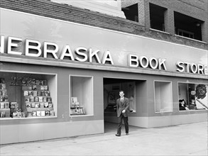 John Cockle walking out of campus bookstore, University of Nebraska, Lincoln, Nebraska, USA, John