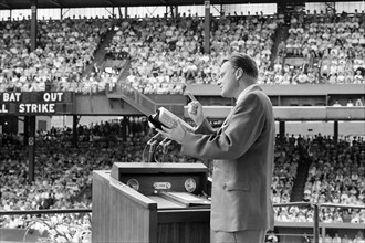 Evangelist Billy Graham preaching to crowd at crusade, Griffith Stadium, Washington, D.C., USA,