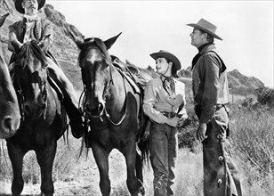 Gloria Talbott, Joel McCrea (right), on-set of the film, "Cattle Empire", 20th Century-Fox, 1958