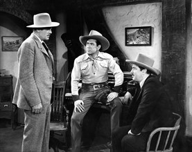 Johnny Mack Brown (center), Robert Barron (right), on-set of the film, "Cheyenne Roundup",